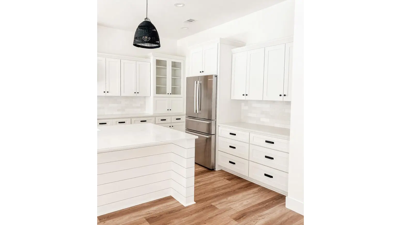 White Shaker sink base under a window - RTA Cabinets Canada